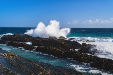 Beautiful landscape view of surfing waves crashing against the beach at Snapper Rocks, Coolangatta, Gold Coast, Queensland, Australia.