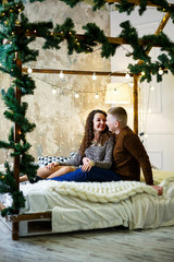 Obraz premium boy and girl in christmas decorations