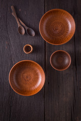 Empty clay bowls on a wooden table. Top view. Concept: food.