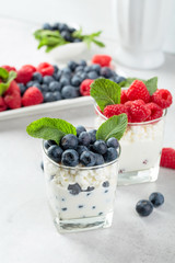 Cottage cheese with cream, raspberry and blueberry.
