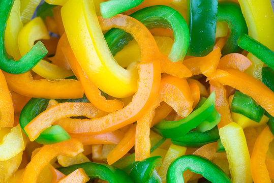 Sliced Pepper. Slices Of Yellow And Green Bell Peppers