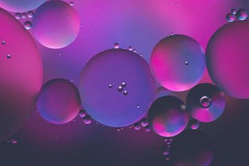 Water and oil, beautiful color abstract background based on blue, neon, purple and pink circles,...