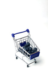 shopping cart with blueberry isolated on white background