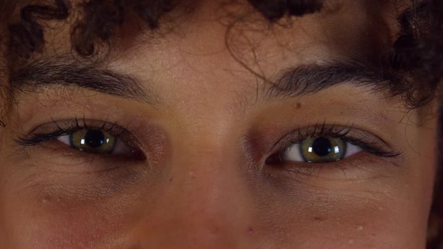young curled hair girl playing green eyes