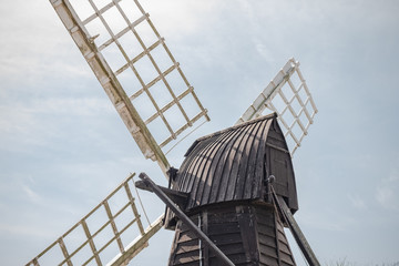 Detailed view of an old and historic timber built windmill dating from the 19th century. Used to pump water from surrounding low land rivers in this low area.