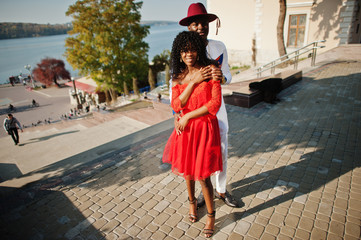 Stylish trendy afro france couple posed together at autumn day. Black african models in love.