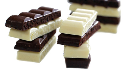 Chocolate is white and black. Porous chocolate. Dessert. Cocoa.