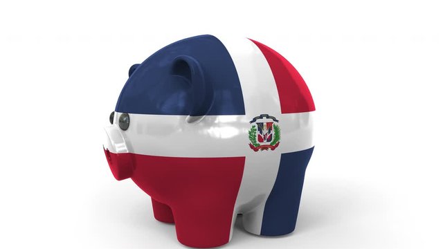 Coins fall into piggy bank painted with flag of the Dominican Republic. National banking system or savings related conceptual 3D animation