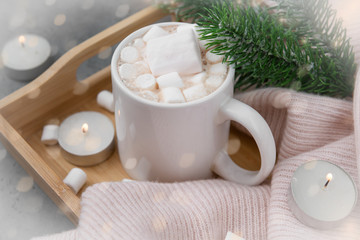 Obraz na płótnie Canvas Cup cocoa, hot chocolate with marshmallows, spruce branch, candles, bokeh on a light