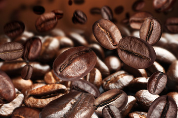 Roasted coffee beans on grey background, closeup