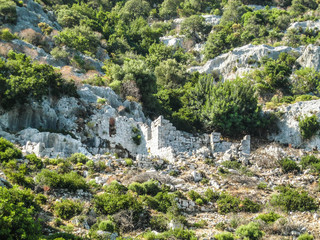 The ruins of an ancient building made of white stone. Highlands in Turkey.