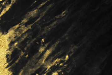 Black and gold marble texture design for cover book or brochure, poster, wallpaper background or realistic business and design artwork.