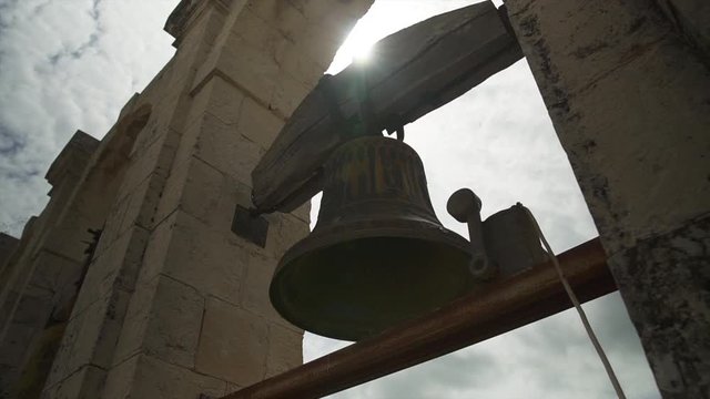 Sun shining through an Ancient Church Bell in Noto, Sicily, Italy