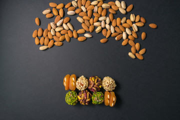 Healthy snacks. Turkish no sugar food. Scattered pistachio and almond nuts. Flat lay. Middle east...
