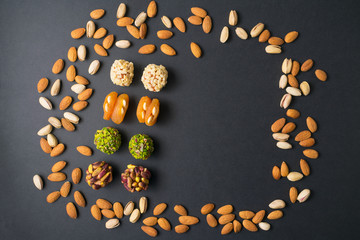 Moroccan fruit and nut candy. Scattered pistachio and almond nuts. Flat lay. Middle east pistachio...