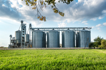 agro-processing and manufacturing plant for processing and silver silos for drying cleaning and storage of agricultural products, flour, cereals and grain. Granary elevator © hiv360
