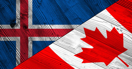 Flags of Iceland and Canada on wooden boards