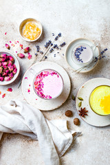 Variety of Moon Milk for a better sleep. Turmeric golden milk, pink rose milk and lavender moon milk. Trendy relaxing bedtime drink