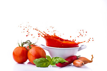 ingredients with vegetables, and tomato puree, with a splash