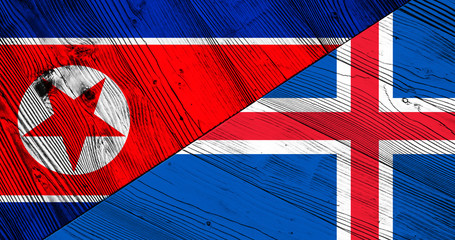 Flags of Iceland and North Korea on wooden boards