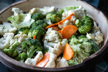 harvesting broccoli and cauliflower for cooking