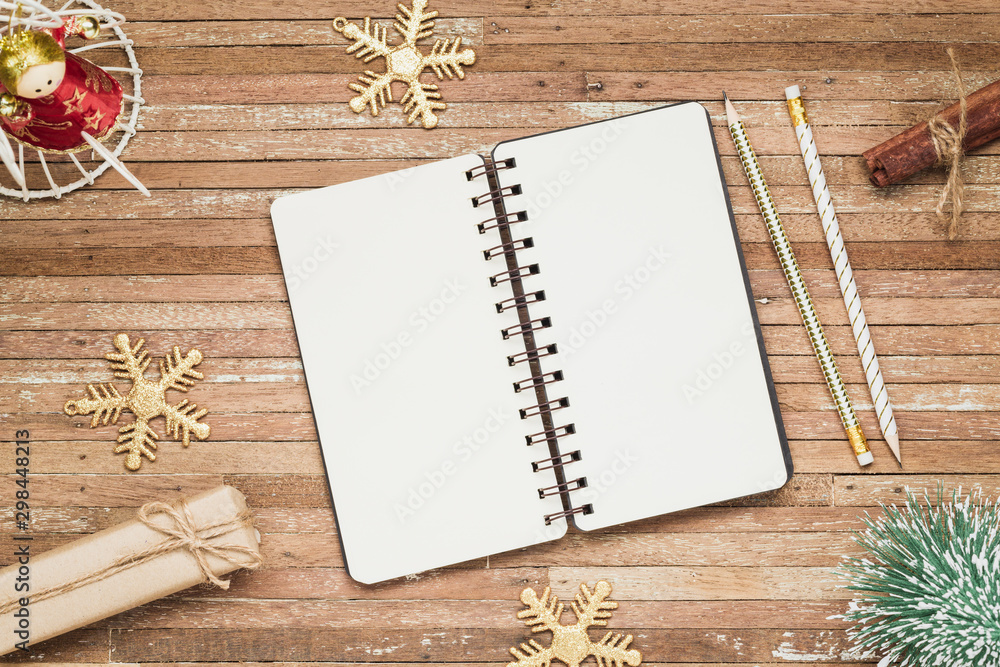 Aufkleber top view of blank notebook on grunge wood background with christmas decorations. mockup xmas backgro