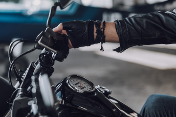 Fototapeta na wymiar Caucasian motorcyclist using his cell phone for navigation