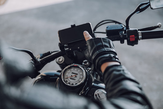Male biker using his cell phone for navigation