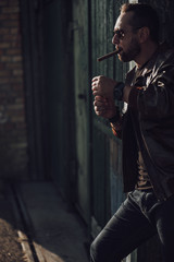 Attractive guy standing near his garage outdoors