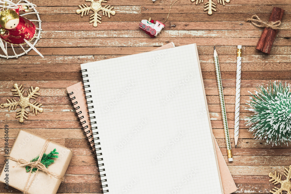 Aufkleber top view of blank notebook on grunge wood background with christmas decorations. mockup xmas backgro