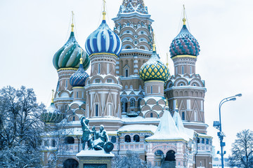 St Basil's cathedral in cold winter, Moscow, Russia. It is a famous landmark of Moscow. Old Red Square after snowfall. Ancient architecture of Moscow under the snow. Concept of Russian frost.