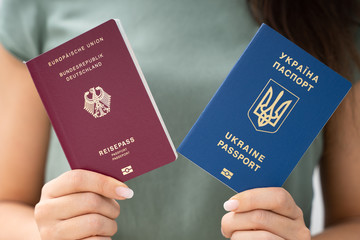 Woman Holding Two Passports