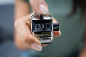 Woman Using Headcounter