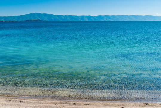 The water surface of Lake Sevan with a beautiful view of the mountains, the famous natural landmark of Armenia