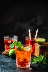 Red fresh cocktail with ice and lime
