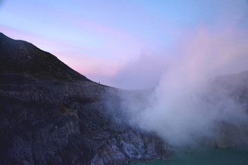 Pink sky at sunrise at the Ijen crater rim, Java