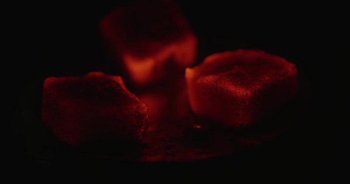 Embers in a cup of hookah at the asian cafe.