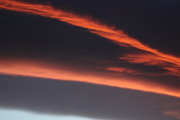 Panoramic view of windy skies in Crete and amazing sunset colored clouds