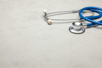 Stethoscope on a gray background