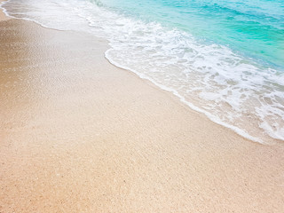 Fototapeta na wymiar wave on brown sand beach