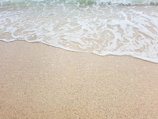 Fototapeta na wymiar wave on brown sand beach