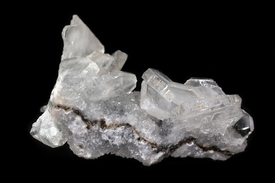 Apophyllite crystal cluster, mineral from India isolated on a pure black background.