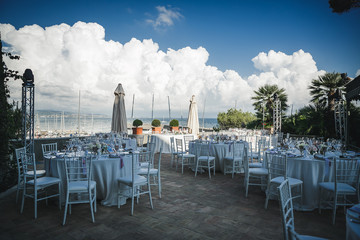 catering at a top event, glasses and flowers on the table, preparation for a significant event, beautiful dishes and glasses on the table, New Year's holiday table