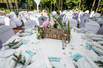 catering at a top event, glasses and flowers on the table, preparation for a significant event, beautiful dishes and glasses on the table, New Year's holiday table