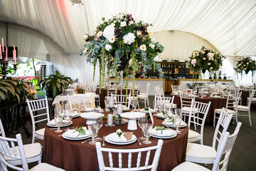 catering at a top event, glasses and flowers on the table, preparation for a significant event, beautiful dishes and glasses on the table, New Year's holiday table