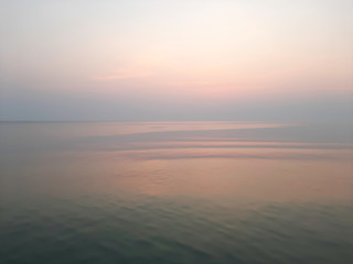 Indigo sea with an orange sky at dawn