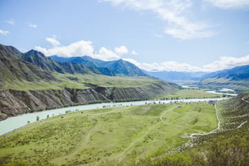 Mountain river in green valley. Wild nature landscape.