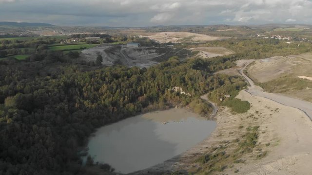 Aerial drone view of abandoned quarry in countryside