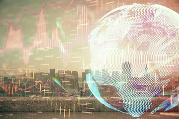 Forex graph on city view with skyscrapers background multi exposure. Financial analysis concept.