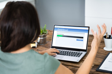 Stressed Woman Looking At Slow Download Speed